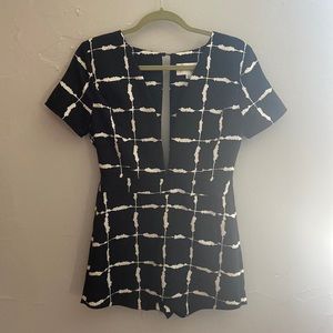 Plunging neckline romper with skort bottom